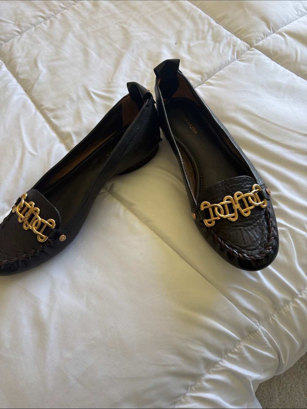 BCBGMaxAzria Black Leather Loafers with Gold Chain Accent